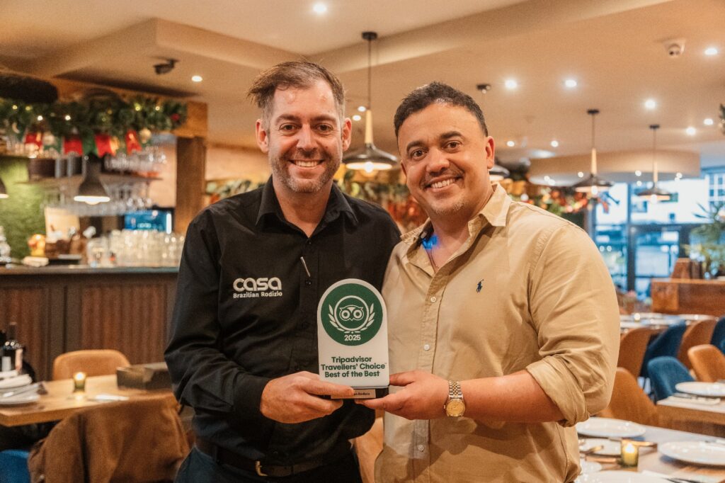 Owner of Casa Rodizio holding award for best of the best.